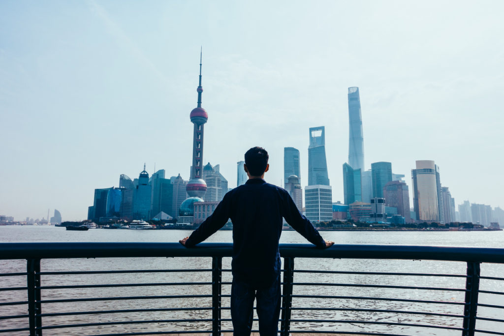 Man looking at Shanghai skyline